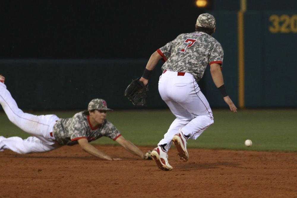 Junior second baseman Stephen Pitarra looks on as freshman shortstop Will Wilson dives and misses a line drive through the middle of the infield in the Wolfpack's 9-8 loss to Campbell on March 21, 2017 at Doak Field.