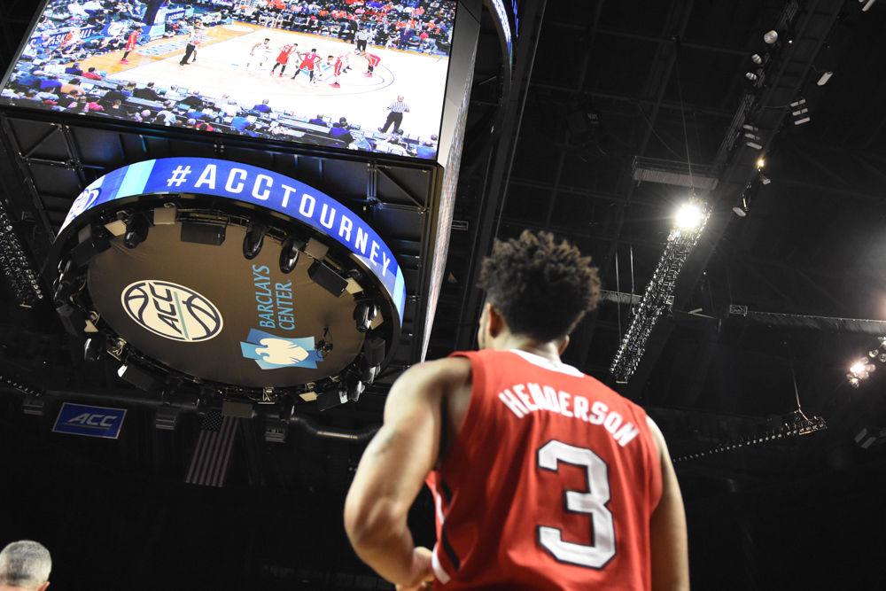 Terry Henderson, a redshirt senior, scans the court before throwing the ball in on March 7 in Barclays Center during the first round of the ACC Tournament. Henderson had 10 points against the Clemson Tigers, but the Pack was defeated,75-61.