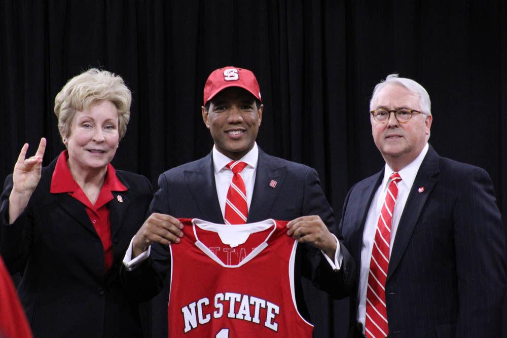 Athletic Director Debbie Yow, New men's basketball coach Kevin Keatts, and Chancellor Randy Woodson pose for a photo during the introductory press conference for Keatts in Reynolds Coliseum on Mar. 19, 2017. Keatts replaced Mark Gottfried as mens basketball coach. Keatts spoke during the conference on his plans for next season and his transition from UNC Wilmington to NC State.