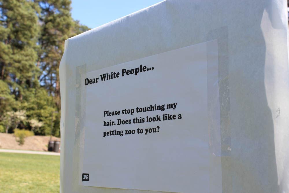 A sign from the "Dear White People" demonstration sits on Stafford Commons on Thursday. The event was sponsored by UAB Films and was intended to spark discussion about common racial stereotypes.