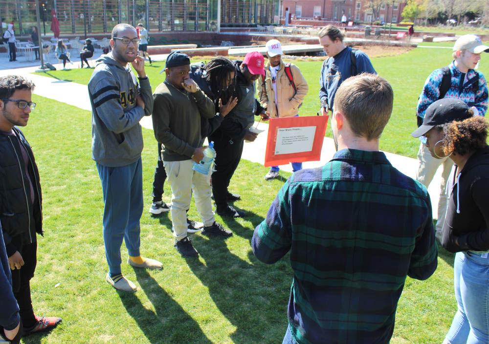 Students gather to discuss the "Dear White People" demonstration on Stafford Commons on Thursday. The event was sponsored by UAB Films and was intended to spark discussion about common racial stereotypes.