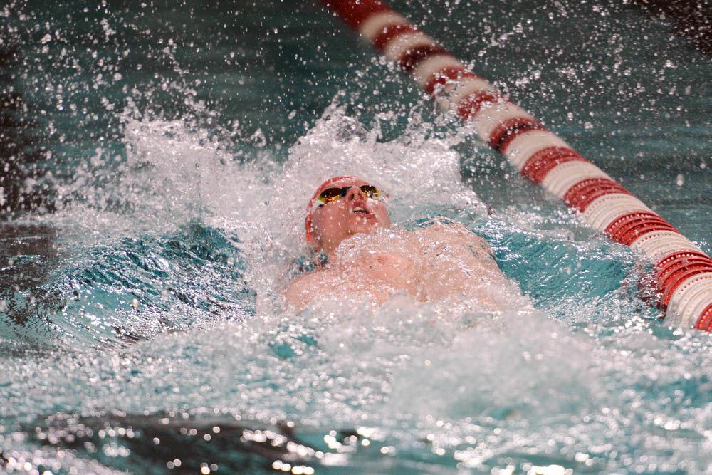 Senior Andreas Schiellerup swims the 100 yard backstroke. The NC State men's and women's swimming teams beat Carolina in 26 of 32 events at Willis R. Casey Aquatic Center on Jan. 27.