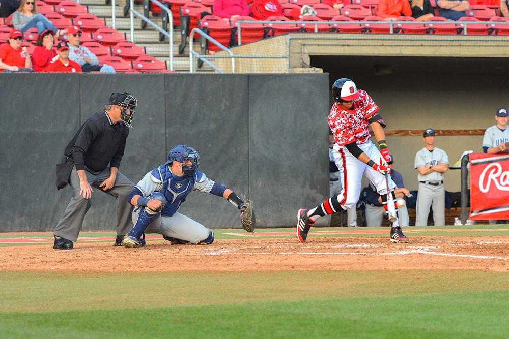 Joe Dunand, a sophomore infielder, hits the ball for a double. Dunand was at bat four times during the game with one hit and one RBI for the game. The NC State men's baseball team beat UNC-Greensboro 8-4 at Doak Field on March 1.