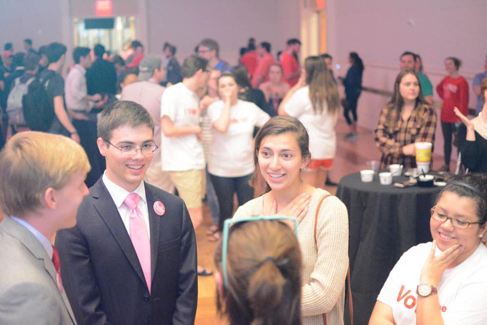 Brad Barbee, Jack Pasby, Mia Connell and Jackie Gonzalez (from left to right) recieve a briefing by Celeste Loia about what to expect next on the campaign trail at the Student Government elections announcement on Tuesday. Barbee and Gonzalez along with their running mates Pashby and Connell earned enough votes to compete in a runoff election, the results of which will be revealed on Thursday.