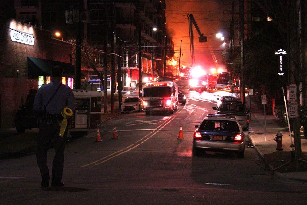 A massive fire broke out in an unfinished apartment building in downtown Raleigh on Thursday, Mar. 16. The fire, which happened on Harrington street, spread to the surrounding vegetation and rooftops of nearby buildings.