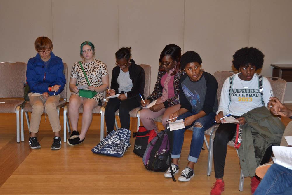 Students end the Tunnel of Oppression tour with a discussion in the State Ballroom on Wednesday. The students talked about each room in the tour and which types of oppression they represented.