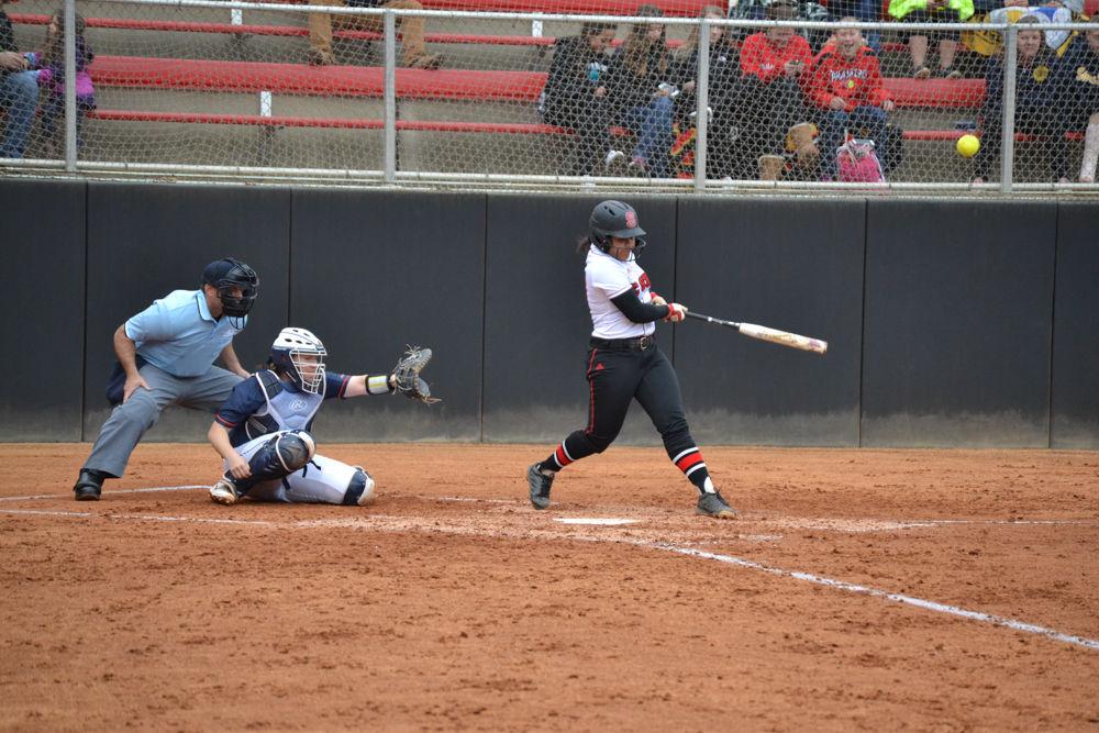 Alyssa Compton hits a pitch from the University of Virginia on Friday, Mar. 17, 2017 in Dail Stadium. Compton plays the positions of short stop and second base.