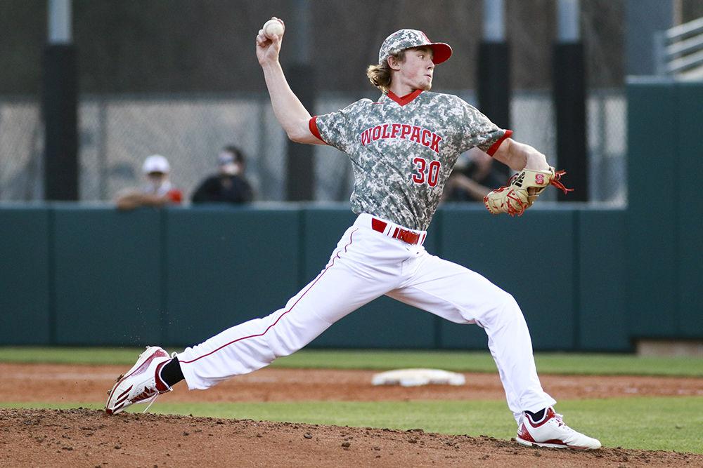 Freshman pitcher Mathieu Gauthier hurls a pitch to home plate in the Wolfpack's game against Campbell on March 2. Gauthier allowed two runs and three hits in one and two thirds innings pitched in the 9-8 loss at Doak Field.