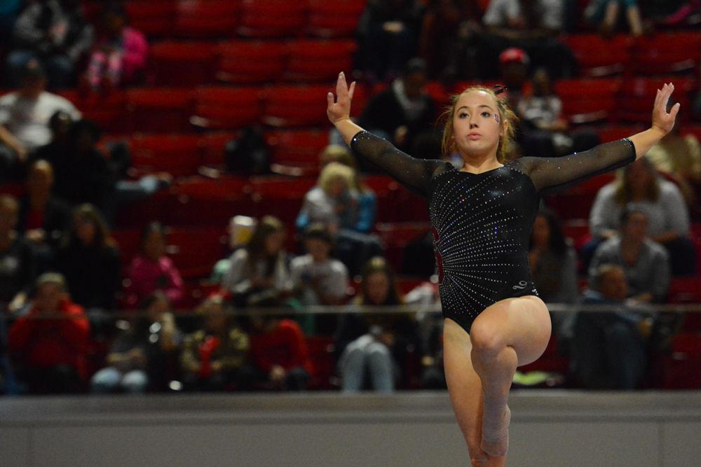 Freshman gymnast Alexis Beucler performs on the balance beam with grace which gave her 4th place in that event at the Reynolds Coliseum on March 18, 2017. Beucler receives 9.875 in the beam event, and 9.050 in the floor event. The Wolfpacks won 3rd place with the score of 194.875 in the meet with GW University, UNH, UNC Chapel Hill, University of Pittsburgh, and Towson University.