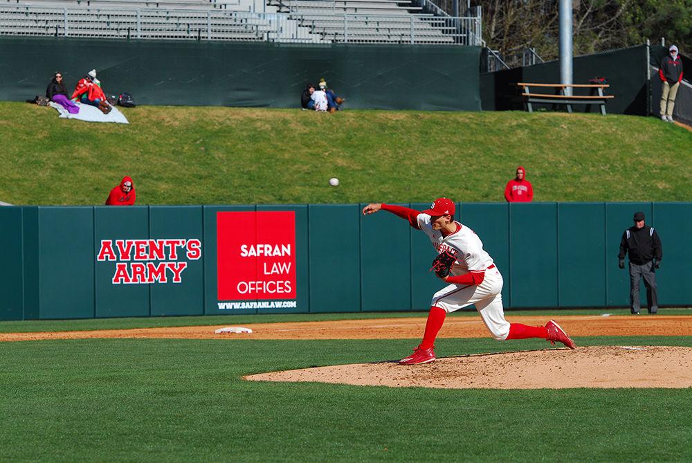 Junior Evan Braband pitches for the NC State Wolfpack against the George Mason Patriots at the home baseball game on Wednesday. The game ended with a 7-3 win for the Wolfpack. The win against the Patriots earns the Wolfpack an improvement to a 10-8 season.