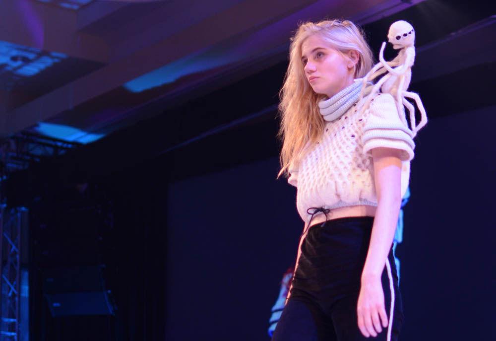 Mary Leggett models "Quasi" by Grace Bilbao, a senior studying art and design for Art2Wear on Friday. Bilbao used knitting, crocheting and felting techniques to create the pieces in her collection, including the "Spider Baby" on Leggett's shoulder.