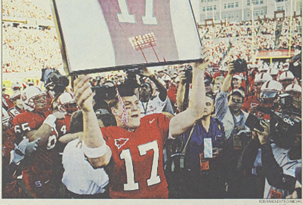 Philip Rivers, a former NC State quarterback, celebrated as his number was added to the walls of Carter-Finley Stadium on Nov. 22, 2003.