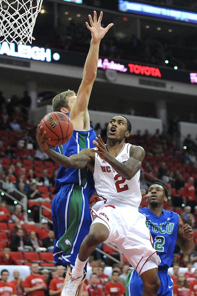 Then-freshman guard Anthony &#8220;Cat&#8221; Barber jumps for a layup against Florida Gulf Coast Tuesday, Nov. 26, 2013. Barber had 12 points in the Wolfpack's 82-62 win over the Eagle's at PNC Arena.&#160;