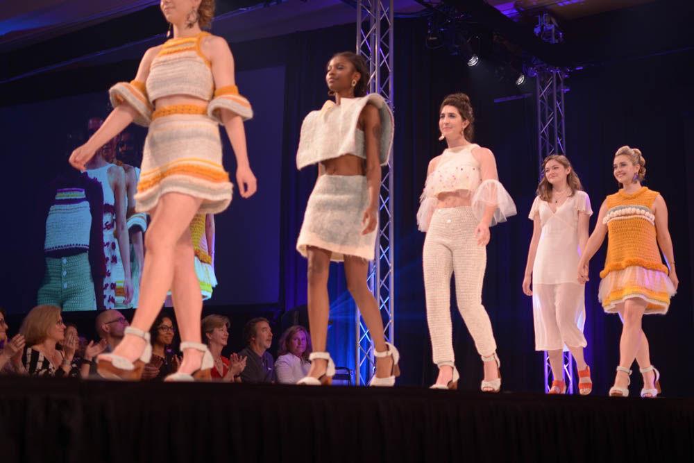 Lizzy Lawrence, a senior studying art and design, joins her models onstage for their final walk for Art2Wear on Friday. Lawrence's collection, called "Madeleine," was inspired by the connection between food and memory.