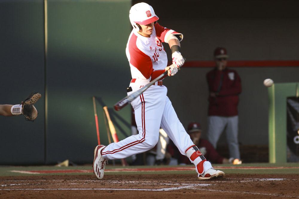 Junior third baseman Evan Mendoza crushes a pitch that sailed for a home run in the Wolfpack's game against Florida State on April, 8 2017. Mendoza had 2 hits, 3 RBIs and 1 run in the 4-3 win at Doak Field.&#160;