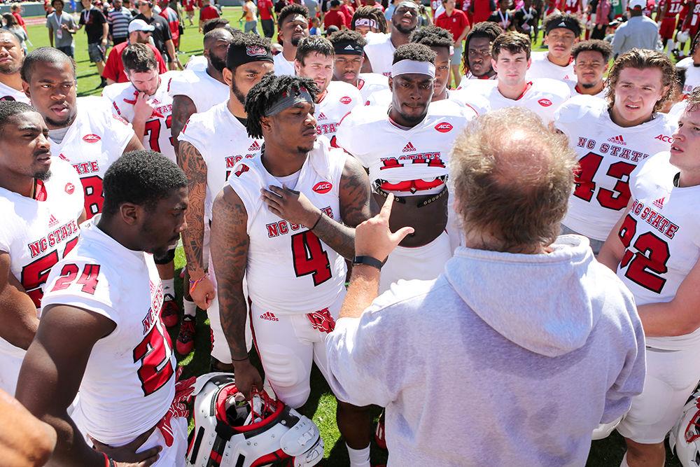 Defensive coordinator Dave Huxtable talks to the white team at the conclusion of the Kay Yow Spring Game on April 1 in Carter-Finley Stadium.