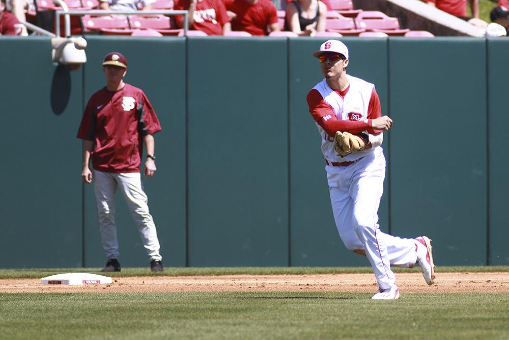 Junior third baseman Evan Mendoza fires the ball back to first base after fielding a grounder in the Wolfpack's 8-4 win over Florida State Sunday at Doak Field.