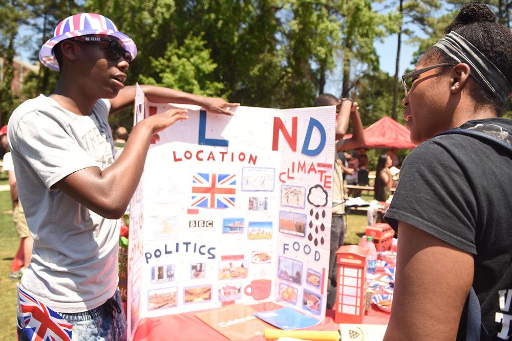 Tyrell Creary from England tells Michaela Brown, a freshman studying psychology, about his country during the International Festival at Stafford Commons on Friday. The International Festival, sponsored by Student Involvement, Student Government, the Multicultural Student Affairs Office and the Office of International Services, gave students the opportunity to learn about different cultures around the world.