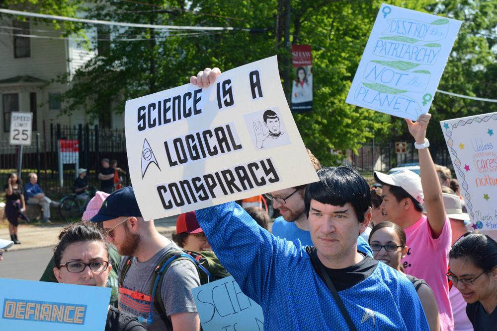A marcher dressed as Spock from Star Trek holds a sign reading "science is a logical conspiracy." Thousands of individuals came to participate in the first ever March for Science held in Raleigh on April 22, 2017, one of the over 500 similar marches held across the world.