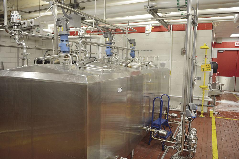 Large tanks located in the Robert H. Feldmeier Dairy Processing Lab hold ice cream mix to be transitioned to tubs for sale. Milk was pasteurized in additional containers in a different section of the lab and then moved to these tanks in preparation for the final stages of production of Howling Cow Ice Cream, stages that occurred on April 12.