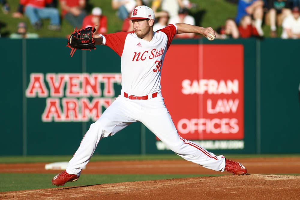 Junior pitcher Brian Brown winds up for a pitch to the plate in the Wolfpack's 4-3 win over Florida State on April 8. Brown allowed just 4 hits and struck out 5 batters in six and one third innings to get his first win of the season.