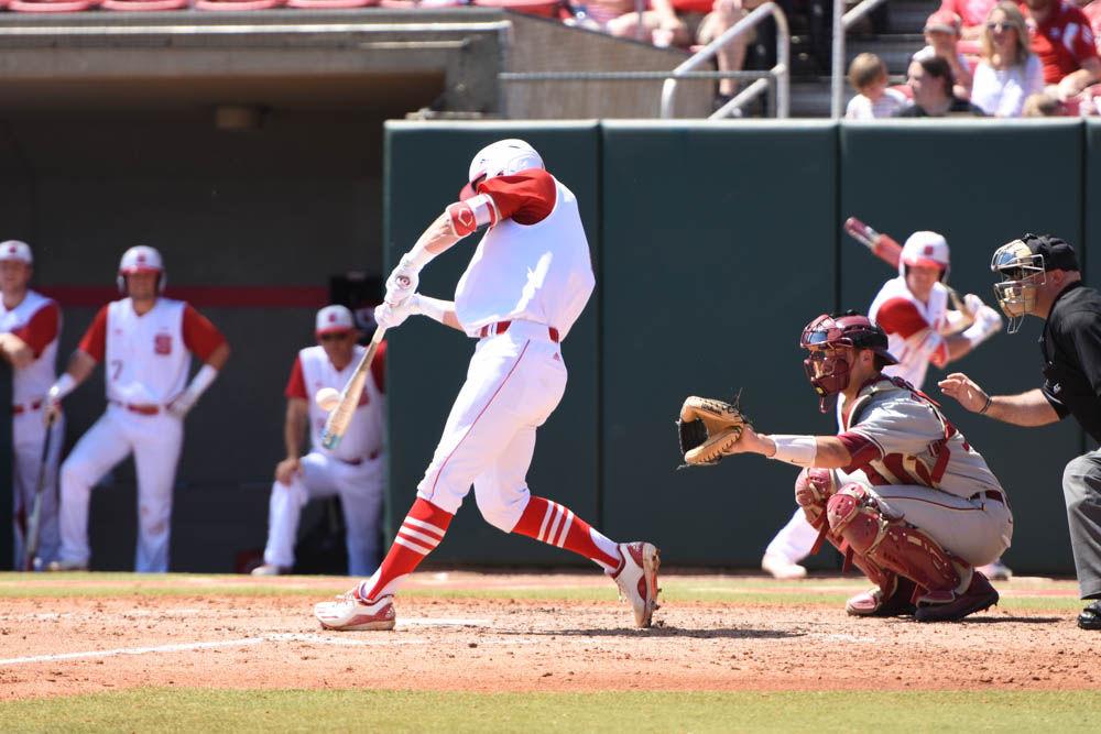 Junior catcher Andy Cosgrove makes contact with a pitch in the Wolfpack's 8-4 win over Florida State on April 9, 2017. Cosgrove had 2 hits and 1 run in three at bats in the win at Doak Field.