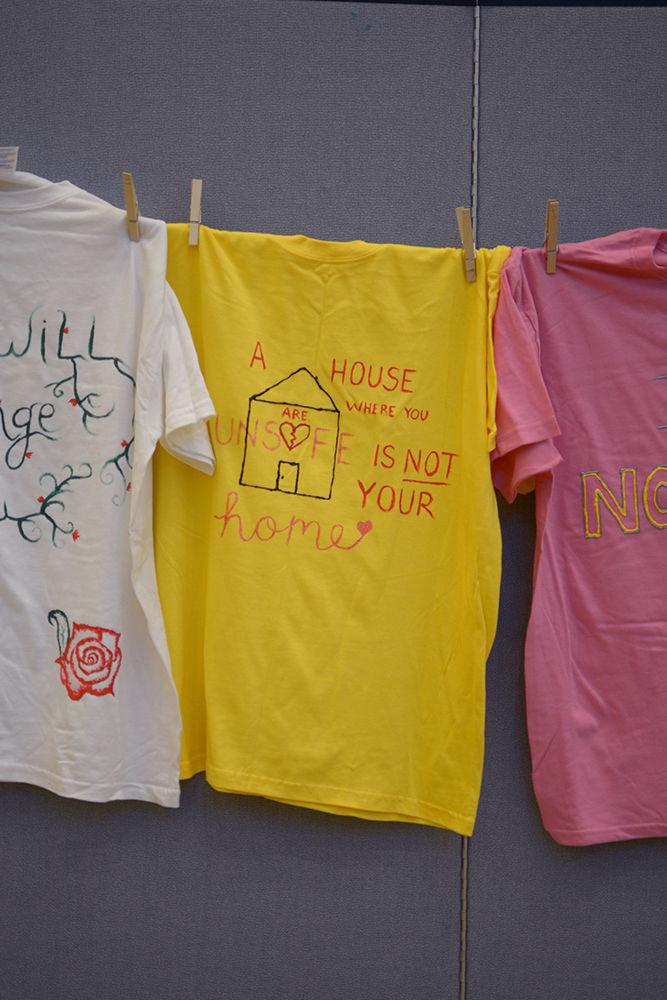 T-shirts hang in Mountains Ballroom as part of Take Back the Night on Wednesday. The Women's Center hosted the event to end rape culture and support assault survivors.&#160;