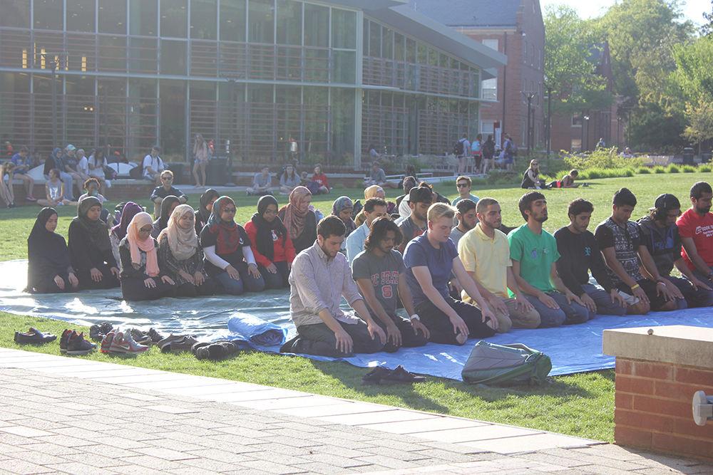 Students pray on Stafford Commons during Islam Awareness Month Tuesday, April 11, 2017. The goal of this year's Islam Awareness Month is to help people understand a different faith. The theme this year is &#8220;Bridging our Differences.&#8221;