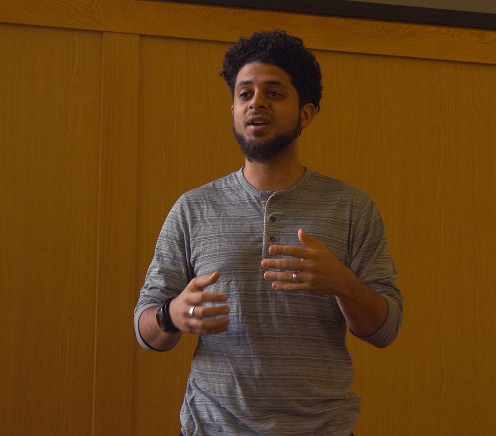 Rakan DiarBakerli, a graduate student in Art And Design: Animation Concentration, discusses the history of Islamic art at the MSA Art Expo on Wednesday. The event was hosted by the Muslim Students' Association to celebrate Islamic art and artists.