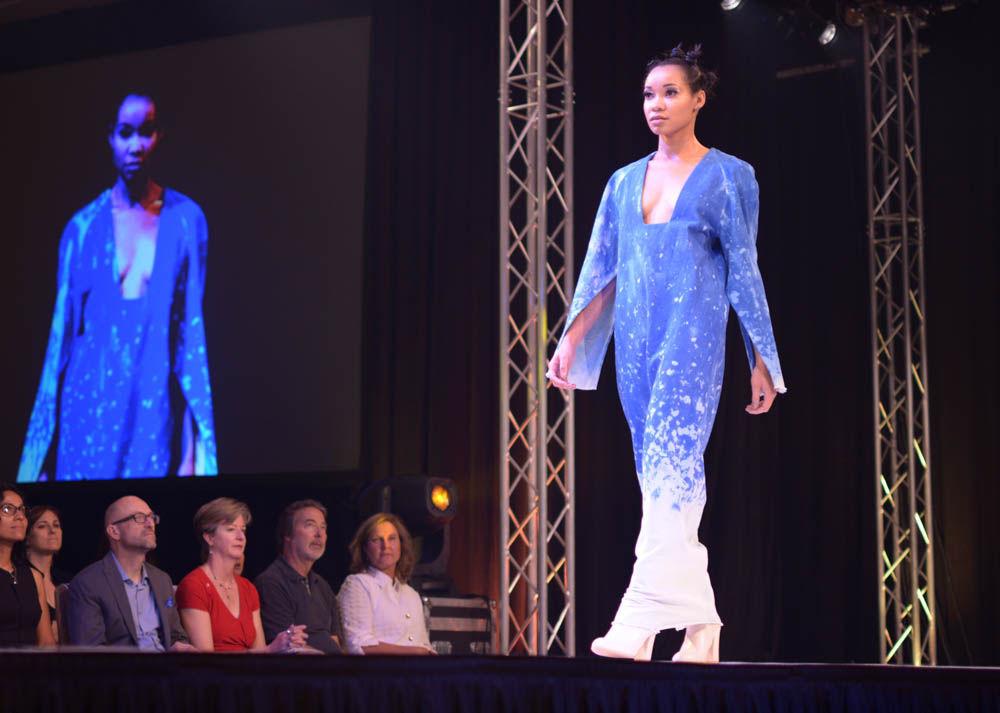 Shira Gaffney models a piece created by Cristina Wright during Art2Wear on Friday in Talley Ballroom. Wright's collection "Retrospect" featured sun-died denim and orange velvet.