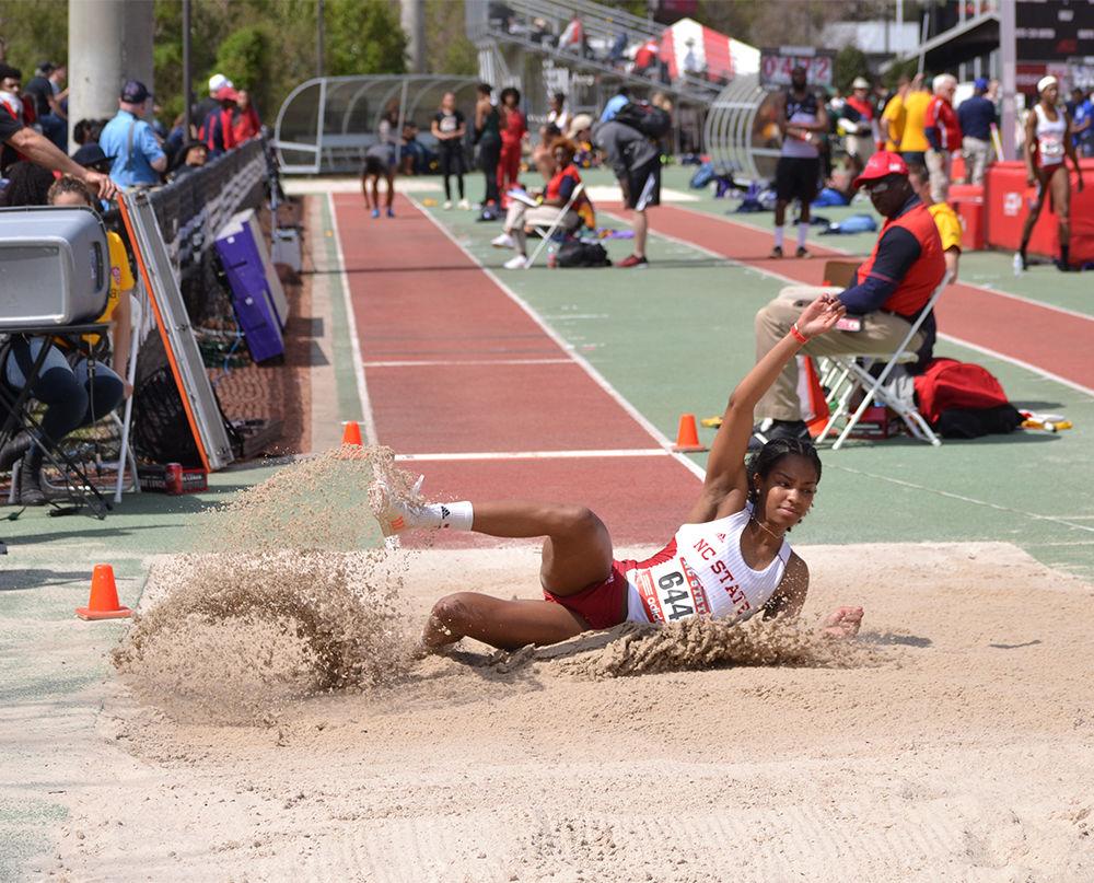 Senior jumper Amara Bell slides into the long jump pit during the Adidas Raleigh Relays on Friday. Bell's best jump was 5.39m, earning her the seventeenth spot overall in the event. In Saturday's triple-jump, Bell finished third with a distance of 12.35 meters.&#160;