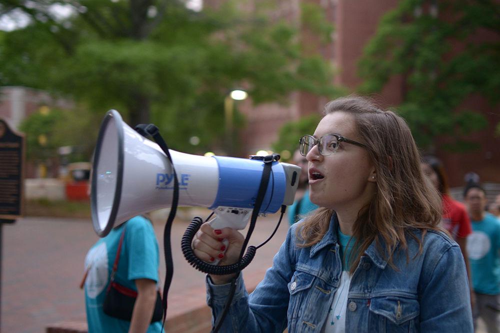 Lauren Frey, a senior studying environmental sciences and women&#8217;s and gender studies, leads the chant for Take Back the Night in Wolf Plaza on Wednesday. The event, which was hosted by the Women's Center, was part of Sexual Assault Awareness Month and was started to help end rape culture and to support assault survivors.&#160;