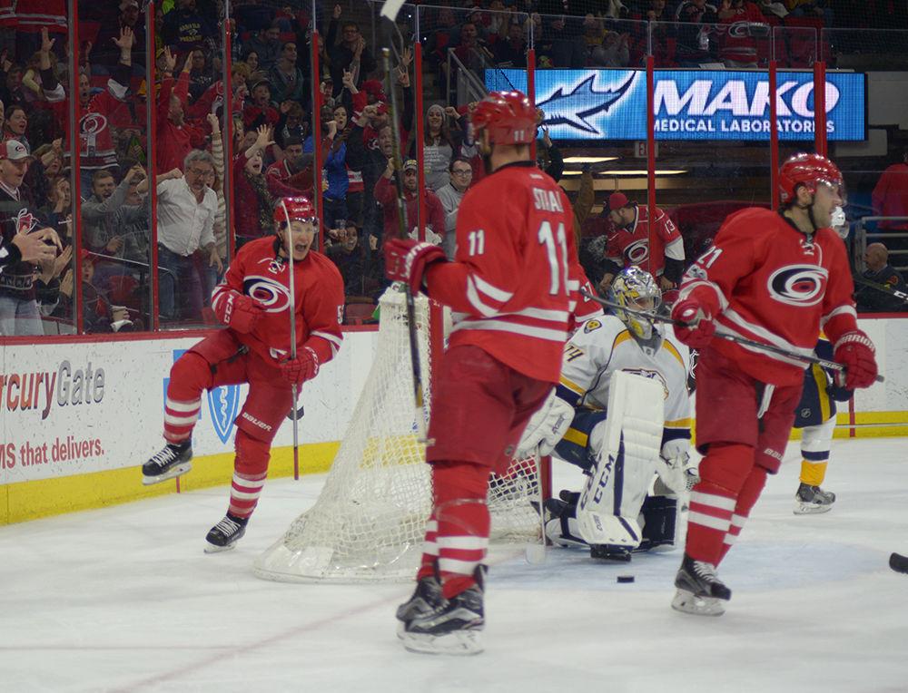 Hurricanes forward Jeff Skinner celebrates his second goal of the night in the second period off an assist from forwards Jaccob Slavin and Jordan Staal. Skinner recorded two goals in the Hurricanes' 4-2 victory over the Nashville Predators in PNC Arena on Saturday.