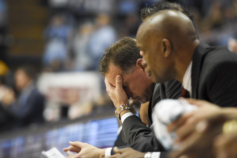 Head coach Mark Gottfried drops his head into his hand as the final minutes tick off the clock as the Wolfpack fall to UNC-CH 107-56 on Jan 8. The Wolfpack shot just 36% from the field in the game at the Dean Smith Center.