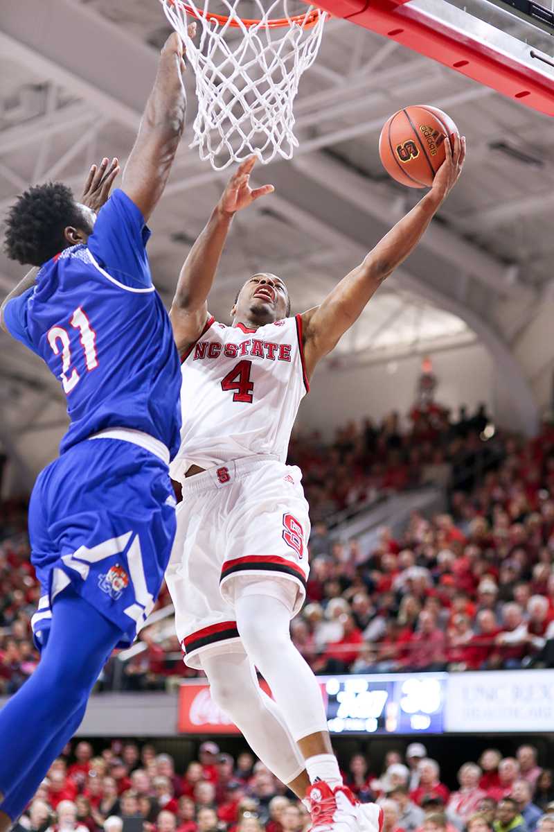Freshman guard Dennis Smith Jr. goes up for a quick basket against Tennessee State during the 67-55 overtime win in Reynolds Coliseum on Dec. 10.