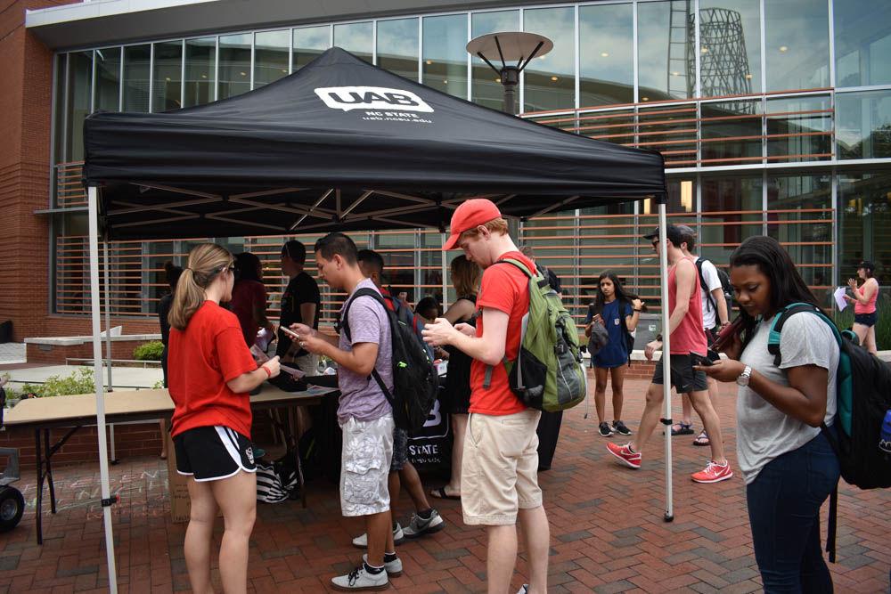 Students follow Union Activities Board on Snapchat to earn a free Last Day of Classes Festival t-shirt or hat at Stafford Commons on April 28. The Union Activities Board ran all the activities on Stafford Commons to help students celebrate the last day of class.