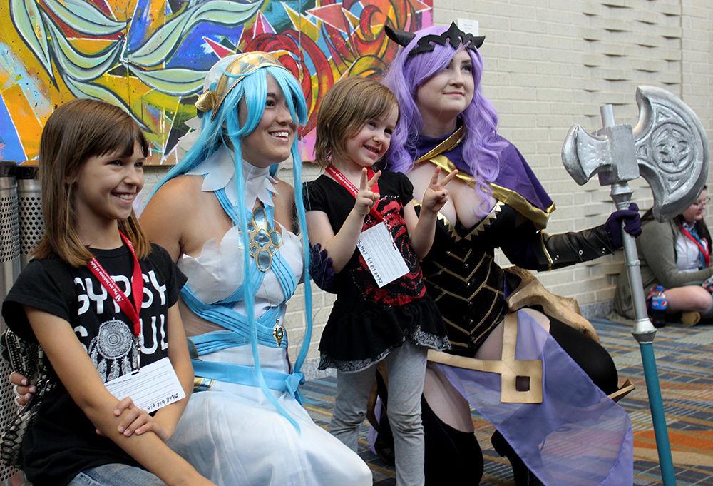 Cosplayers Amanda Myers and Nora Skinner pose for a photo with young attendees Krystal and Izzie at Animazement on Sunday, May 28. Many of the event's attendees create elaborate costumes to wear and display of popular Japanese characters. Animazement is an annual three-day anime convention that ran from May 25-28 at the Raleigh Convention Center.