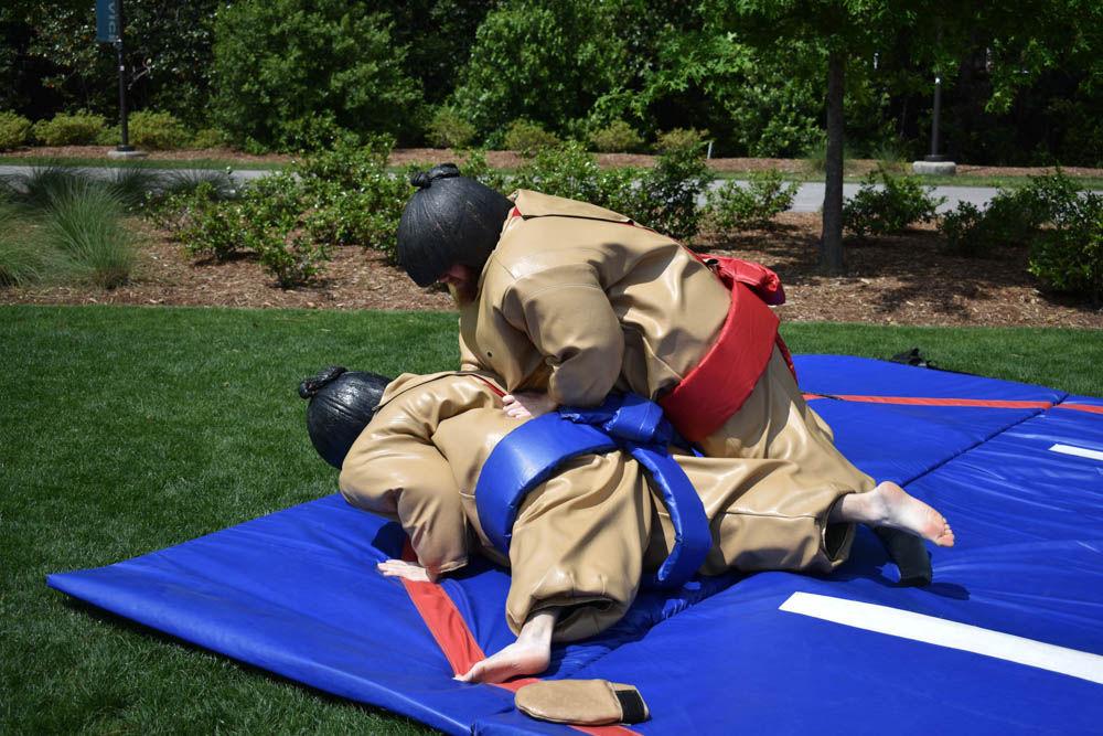 Griffin Geiger, a freshman studying electrical computer engineering, tackles Jacob Lewis, a freshman in life sciences first year, as sumo wrestlers in Stafford Commons on April 28. Sumo wrestling was one of the many activities available for students to celebrate the last day of classes.