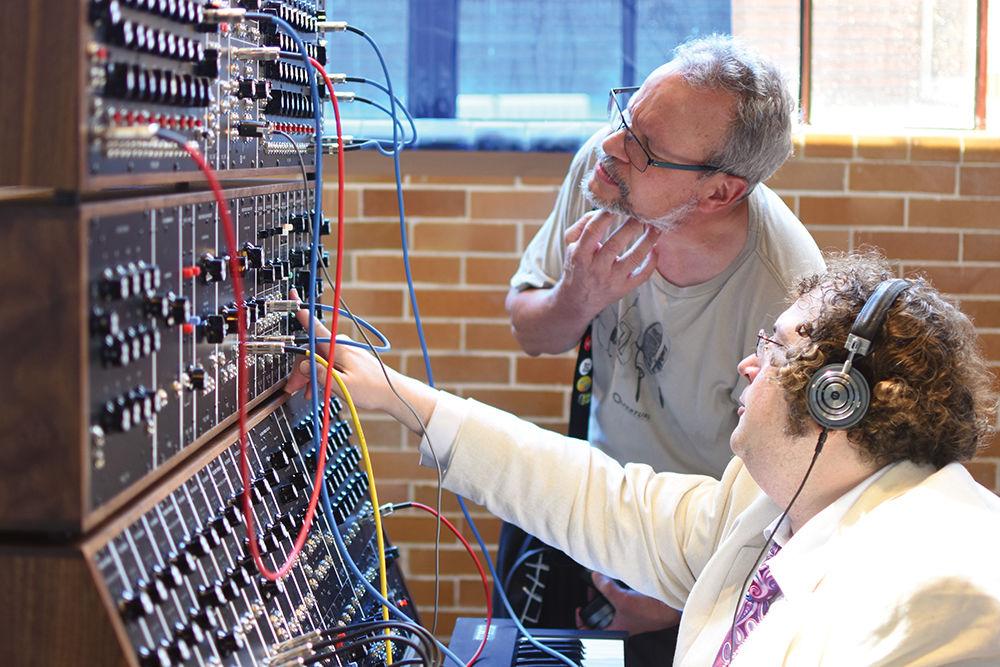 John Drake, a musician and synthesizer builder under the name of Suit &amp; Tie Guy, familiarizes Moogfest attendees with the Moog IIIC Modular system on Friday, May 19, 2017. Several Moog products were available for purchase at the Moog Pop-Up Factory at Moogfest.