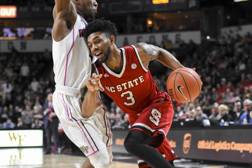 Redshirt senior guard Terry Henderson drives around a defender on the baseline in the Wolfpack's 88-58 loss to Wake Forest on Feb. 11. Henderson made just one shot from the field and missed all five of his three point shots in the loss at Lawrence Joel Veterans Memorial Coliseum.