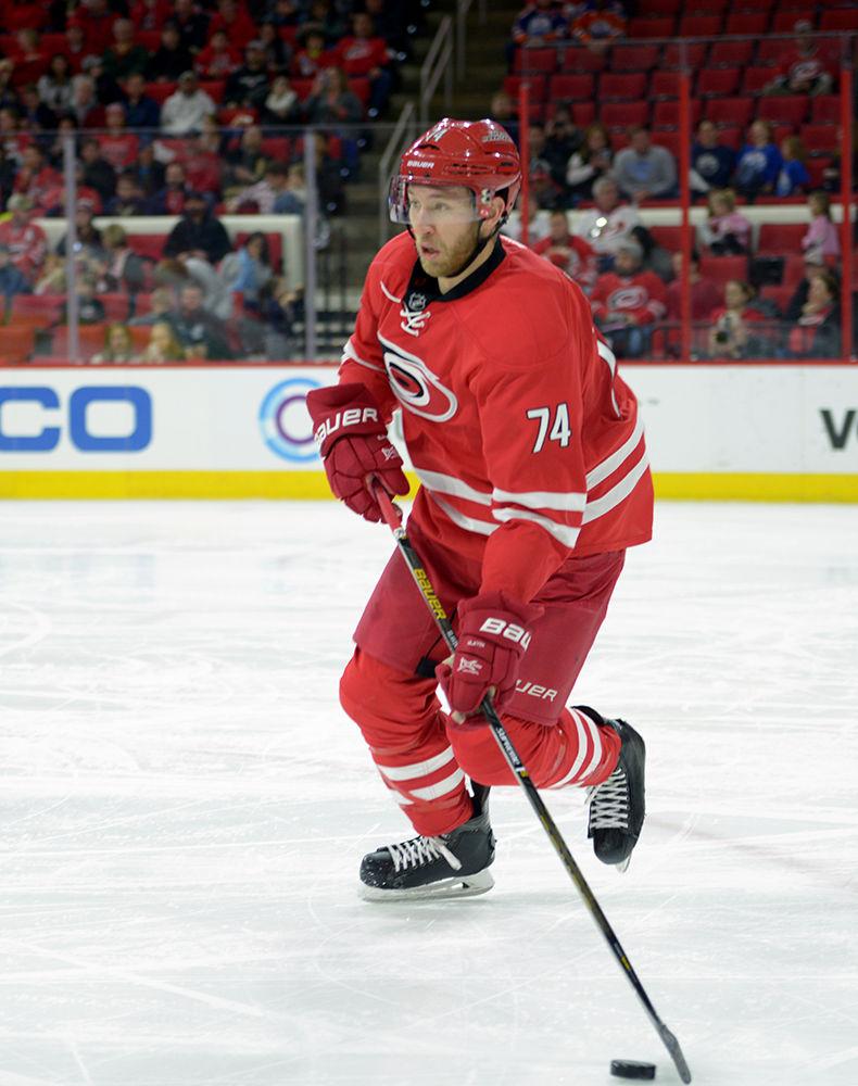 Hurricanes defenseman Jaccob Slavin looks for an open pass to clear the puck. Slavin recorded one assist in the Hurricanes' 2-1 victory over the Oilers in PNC Arena on Feb. 3.