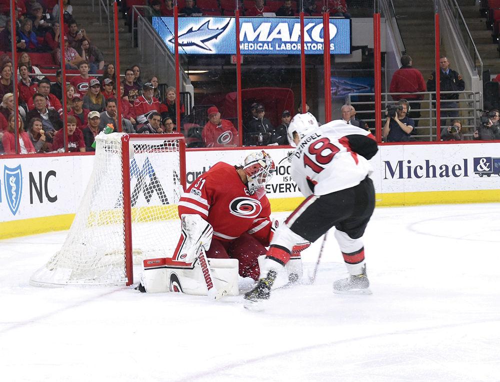 Hurricanes goalie Eddie Lack stops Senators center Ryan Dzingel during the Canes 3-0 victory in PNC Arena on Feb. 24. Lack stopped 34 shots on net to earn his first shutout of the season.&#160;
