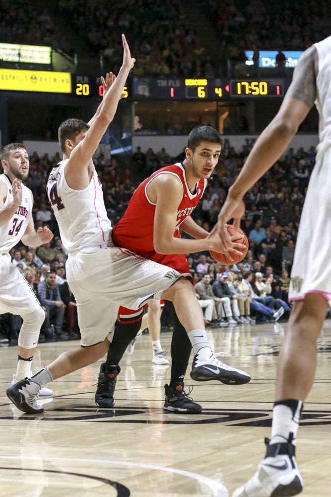 Freshman center Omer Yurtseven fights through traffic towards the basket in the Wolfpack's 88-55 loss to Wake Forest on Feb.11. Yurtseven made one of four field goals and had four total points in the loss at Lawrence Joel Veterans Memorial Coliseum.
