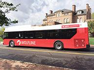 The logo and color scheme featured on the sides of Wolfline buses in the new fleet are designed by two students from the College of Design. They pay tribute to staple NC State symbols such as the howling wolf and the colors red and black.