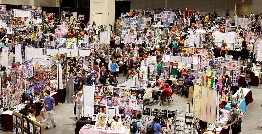 Animazement attendees walk through the Artist's Alley on Saturday, May 27. This area of the convention offered attendees the chance to buy handmade pieces of art depicting their favorite characters from shows, movies and video games. Animazement is an annual three-day anime convention that ran from May 25-28 at the Raleigh Convention Center.