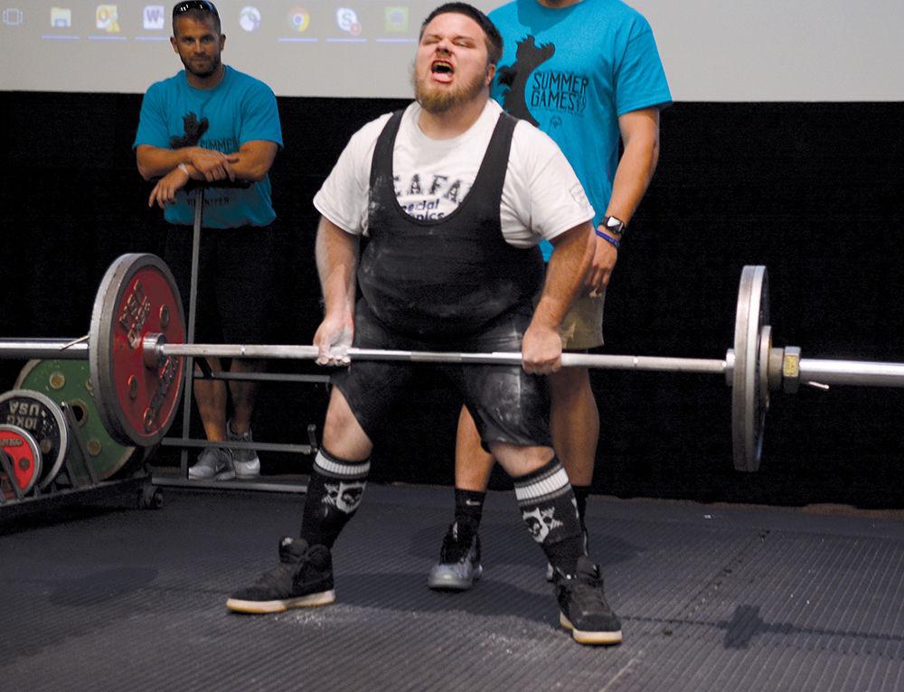 Jessy Riley from Cleveland County painfully lifts a heavy weight during the triple combo competition in the powerlifting event at the Witherspoon Student Cinema as part of the Special Olympics Saturday, Jun 3 2017. Powerlifting was among several events taking place on campus during the Special Olympics Summer Games. The Olympics allow those with disabilities across North Carolina the chance to compete in various sporting events.
