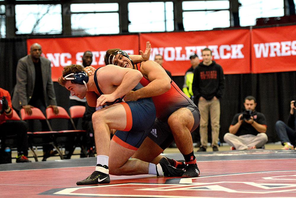 Redshirt senior Nick Gwiazdowski, ranked no. 1 nationally, tries to gain leverage on his opponent from behind in the Wolfpack's meet against #17 Virginia on Jan. 17, 2016.&#160; The 285-pound Gwiazdowski won his bout 19-3 on a technical fall and helped the Wolfpack to a 35-7 win over Virginia at Dorton Arena.