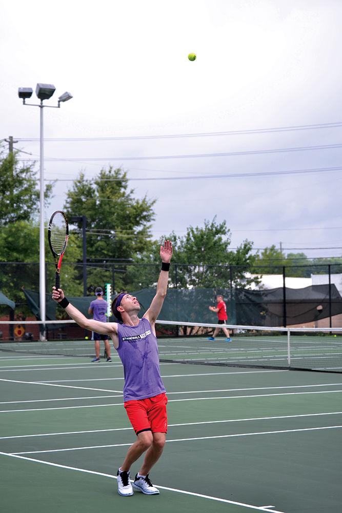 Joe Lyons competes against Tim Blair in a singles match at William Peace tennis courts on Saturday, June 17. Lyons won the match 6-1 for his team Total Topspin. &#8220;I decided to play in the tennis league because I play a lot of other Stonewall Sports and I have played tennis all my life, so it was a perfect marriage,&#8221; Lyons said.