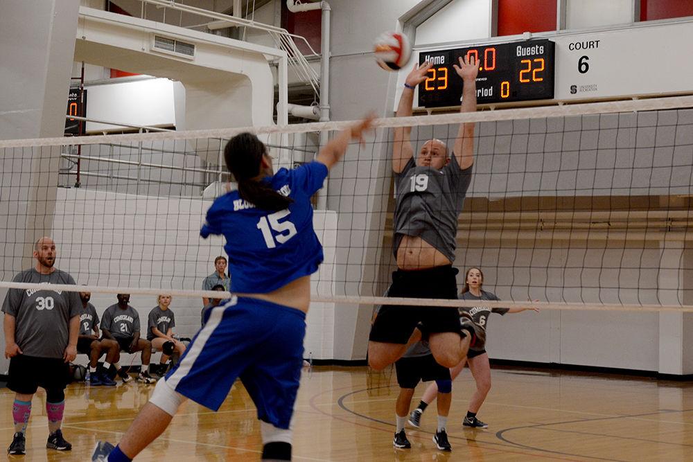 Tommy Kraus, Captain in the U.S. Army from Fayetteville tries to go for the ball after Joshua Mallia from Jacksonville hits it over the net during a volleyball match between his team the Cumberland County Troublemakers and Onslow County Block and Roll teams at Carmichael Gymnasium as part of the Special Olympics Saturday, Jun 3 2017. Kraus' team won the match 25 to 22. Volleyball was among several events taking place on campus during the Special Olympics Summer Games. The Olympics allow those with disabilities across North Carolina the chance to compete in various sporting events.