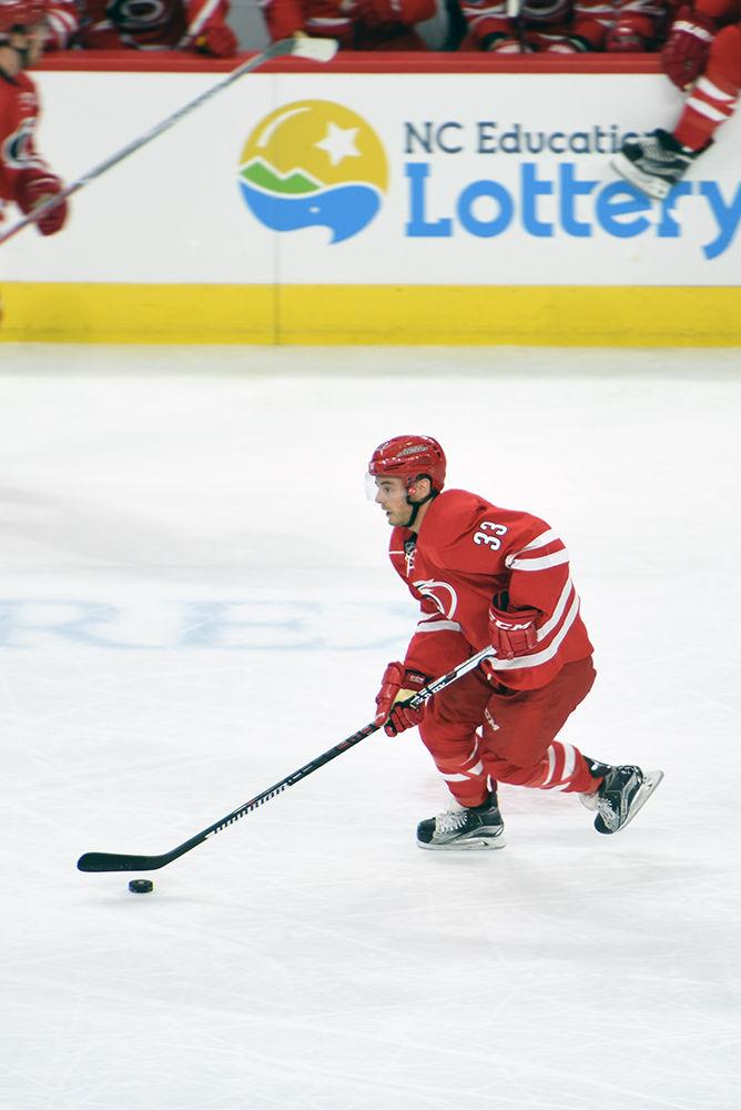 Hurricanes forward Derek Ryan carries the puck through the neutral zone during the game against the Buffalo Sabres on Jan. 13 in PNC Arena. Ryan earned one assist for forward Jeff Skinner's goal early in the second period.